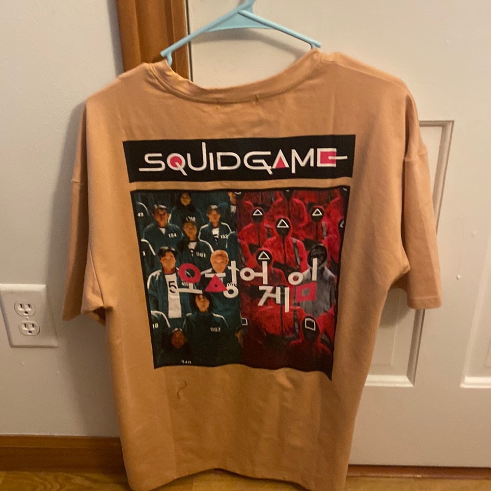 A normal tan cream squid game shirt from Dubai rare